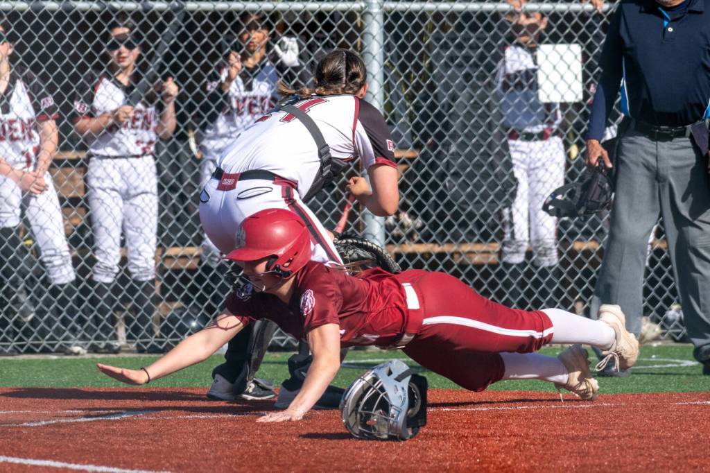 PHOTO BY FOREST WORGUM Hoquiams Lexi LaBounty slides in save at home during a 12-6 loss to Raymond-South Bend on Thursday in South Bend.