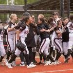 KODY CHRISTEN | THE CHRONICLE The Raymond-South Bend Ravens erupt with joy after beating Adna in the 2B District 4 semifinal game on Wednesday in Centralia.