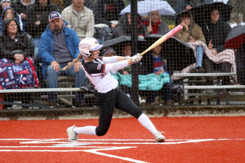 RYAN SPARKS | THE DAILY WORLD Raymond-South Bend center fielder Emma Glazier belts one of her two home runs against Pe Ell-Willapa Valley in the 2B District 4 Championship game. The game was postponed due to darkness with RSB leading 16-11 after six full innings. The game will resume at 4 p.m. on Friday at Fort Borst Park in Centralia.