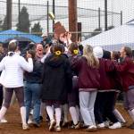 PHOTO BY HAILEY BLANCAS The Montesano Bulldogs hoist the 1A District 1/4 trophy after defeating Seton Catholic 14-6 on Thursday at Fort Borst Park in Centralia.