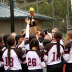RYAN SPARKS | THE DAILY WORLD The Raymond-South Bend Ravens hoist the 2B District 4 championship trophy after defeating Pe Ell-Willapa Valley 16-12 on Friday in Centralia.