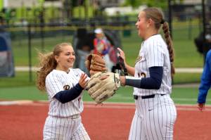 RYAN SPARKS | THE DAILY WORLD Aberdeen outfielder Scotlyn Lecomte (left) and pitcher Lilly Camp high-five one another during the Bobcats 4-0 win over Ridgefield in a 2A District 4 elimination game on Friday in Chehalis.