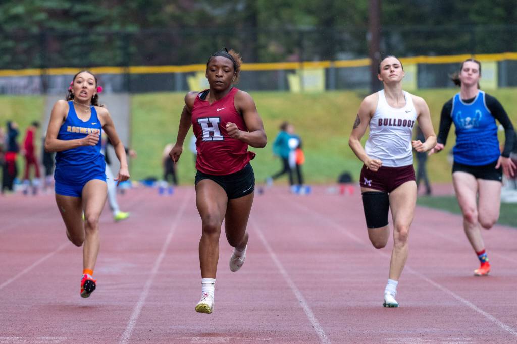 PHOTO BY FOREST WORGUM Hoquiams RanaèJah Burtenshaw (second from left) outruns (from left) Rochesters Merecedies Dupont, Montesanos Hailey McElroy and Elmas Emily Escoffon in the girls 100 meters at the 1A Evergreen League Championships on Friday at Montesano High School.