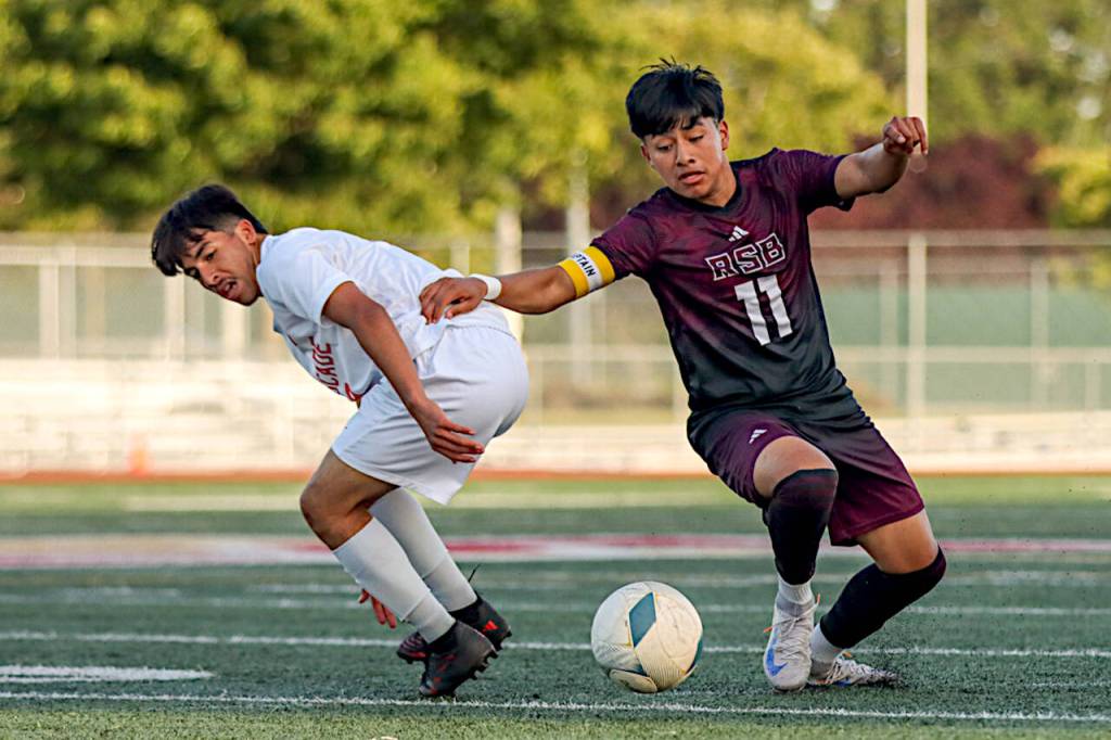 PHOTO BY MATT RUMBLES Raymond-South Bends Edgar Ramirez (11) dribbles around a Cascade defender during a 1-0 win on a 1A State second-round game on Friday in Tacoma.
