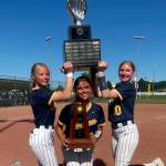 SUBMITTED PHOTO Aberdeen players (from left) Rylee Hendrickson, Alyssa Yakovich and Britten Neal were all smiles while taking photos with the 2A State Championship trophy on May 24 in Selah.