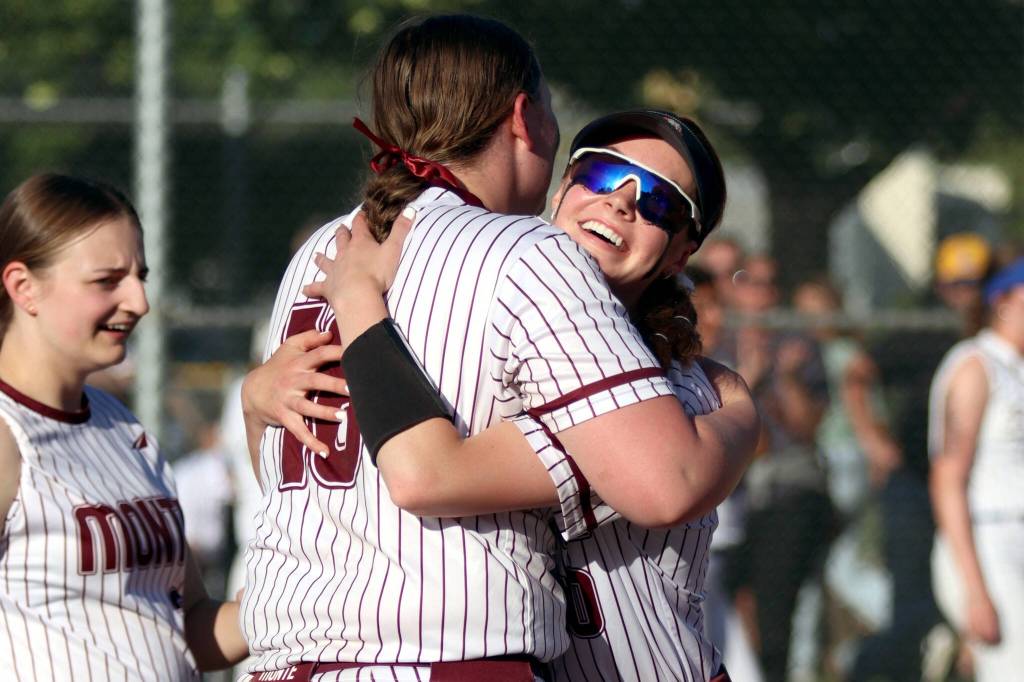 PHOTO BY HAILEY BLANCAS Montesanos Liv Robinson (right) hugs teammate Kylee Wisdom after winning the 1A State Softball Championship on May 24 at the Columbia Playfields in Richland.