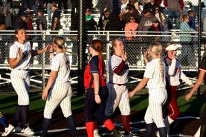RYAN SPARKS | THE DAILY WORLD Players go through the postgame handshake line after the conclusion of the Senior Showcase softball game on Thursday at Centralia College.