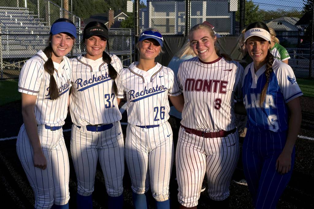 RYAN SPARKS | THE DAILY WORLD Rochesters Arrissa LeBaron (left), Layna Demers (32) and Cheyenne Justice (26) pose for a photo with Montesanos Ali Parkin (3) and Elmas Mia Monroe at the Senior Showcase softball game on Thursday at Centralia College.