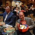 Mayor of Montesano Tyler Trimble shows off his raffle prize basket at the GGHI Leaders Banquet at the Quinault Beach Resort and Casino in Ocean Shores.