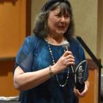 North Beach PAWS President Carol Jamroz gives an acceptance speech for Non-Profit of the Year at the GGHI Leaders Banquet at the Quinault Beach Resort and Casino in Ocean Shores.