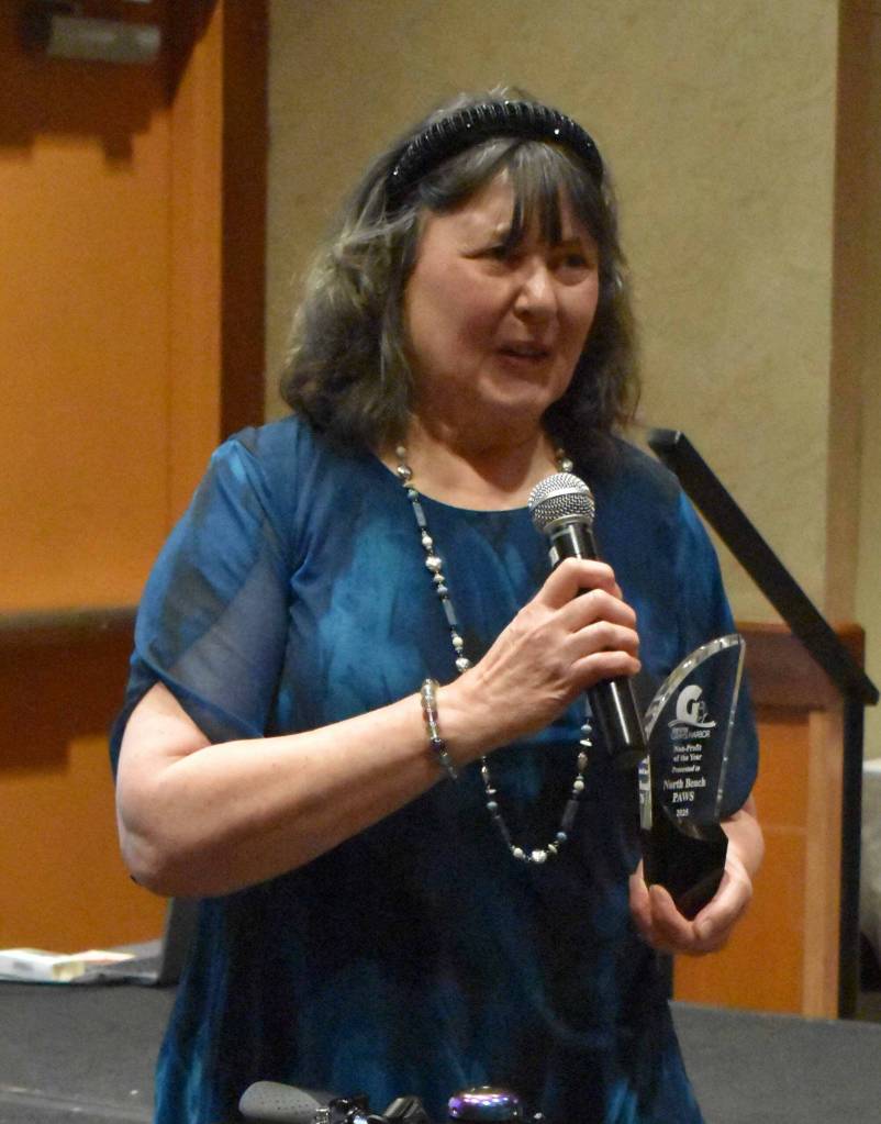 North Beach PAWS President Carol Jamroz gives an acceptance speech for Non-Profit of the Year at the GGHI Leaders Banquet at the Quinault Beach Resort and Casino in Ocean Shores.