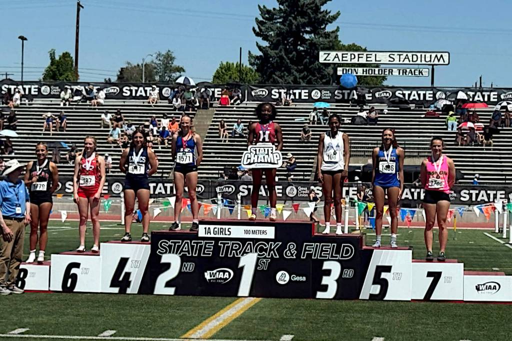 SUBMITTED PHOTO Hoquiams RanaèJah Burtenshaw (1) stands atop the podium after posting a time of 12.24 to win the 1A State Championship in the girls 100 meters on Saturday at Zaepfel Stadium in Yakima.