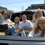 RYAN SPARKS | THE DAILY WORLD Aberdeen senior softball players (from left) Lilly Camp, Kadence Braaten, Abby Mainio, Zoe Vessey and Scotlyn Lecomte prepare for the beginning of a parade and celebration in honor of the teams state championship.