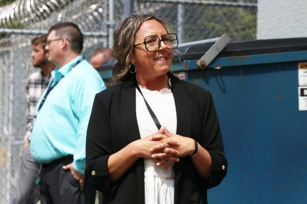 Department of Children, Youth and Families Deputy Assistant Secretary Rebecca Kelly speaks during a media tour of Harbor Heights near Aberdeen on Thursday, May 29.