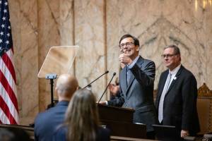 Ridley Hudson / The Chronicle
Gov. Bob Ferguson gives a thumbs up to his family during his inaugural address at the Washington State Capitol in Olympia on Wednesday, Jan. 15.