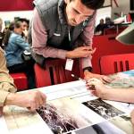 Chinook Observer photos
Port of Willapa Harbor manager Jim Sayce, Department of Ecology coastal resilience engineer Sam Giannakos, and PCDs education and outreach program manager Alex Birk look at historical photographs of South Bend.