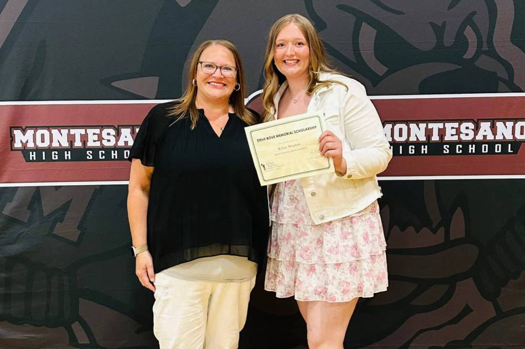 PHOTO COURTESY OF MONTESANO HIGH SCHOOL Angela Bove (left) presented the Steve Bove Memorial Scholarship to Bulldogs graduate Kylee Wisdom in a ceremony at Montesano High School on Wednesday.