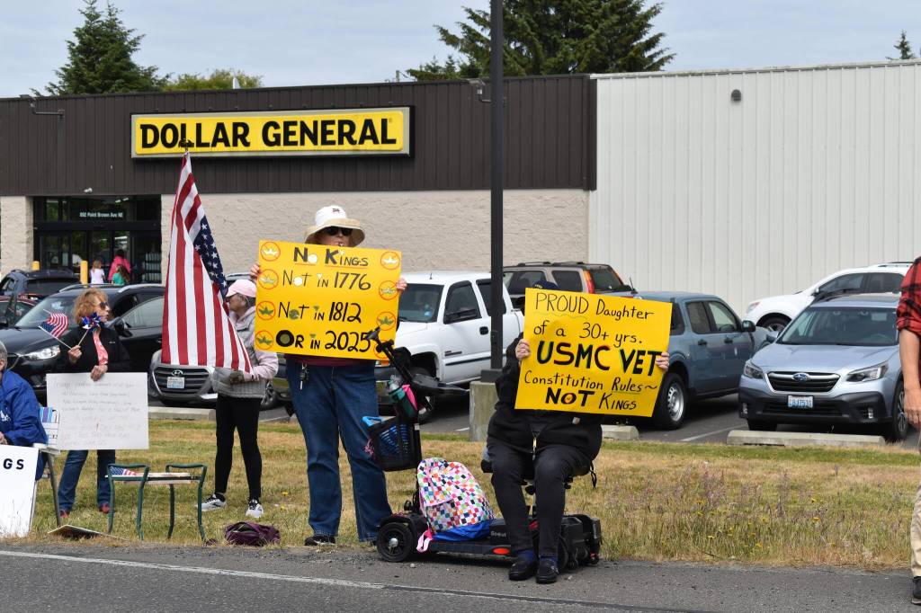 Protestors carried signs and American flags during the No Kings protest in Ocean Shores.