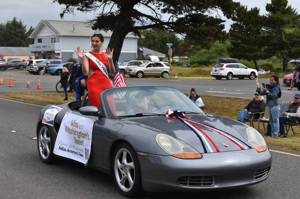 Miss Washingtons Teen Emma Adams waves to onlookers at the Ocean Shores Flag Day Parade.
