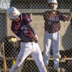 PHOTO BY FOREST WORGUM Montesanos Levi Glowacki smacks a base hit during a 14-8 win over Capitol Little League in the District 3 Juniors Division Championship game on Wednesday in Olympia.
