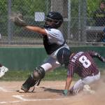PHOTO BY FOREST WORGUM Montesanos Micah Eaton (8) slides in ahead of the tag of Elma catcher Chase Sample during a Little League District 3 Major Tournament game on Sunday in Montesano.