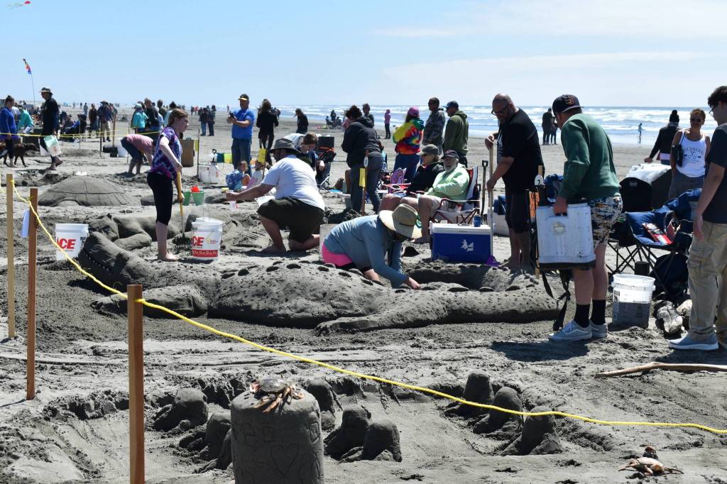 Ruth Arkless / For The Daily World
Sand sculptors scramble to finish their creations before the judging begins.