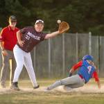 PHOTO BY FOREST WORGUM
Montesano third baseman Arik Barnes (33) catches a throw during a 14-0 loss to East Jefferson in a Little League Junior Division State Tournament game on Sunday in Port Orchard.