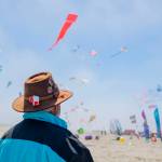 A Westport Windriders Kite Festival participant with 40 years of kite flying experience, viewing the kites.