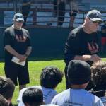 The Daily World photos
Former NFL coach Mike Haluchak (front) speaks to the athletes at the Grays Harbor Football Camp with camp founder Dana LeDuc (back).