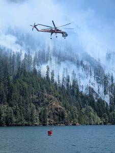 InciWeb
The Bear Gulch Fire continues to burn in the southeast region of the Olympic National Park. Helicoptors continue to scoop water out of Lake Cushman to douse the fire.