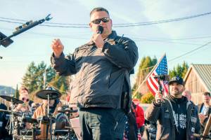 The Chronicle file photo
Patriot Prayer Founder Joey Gibson films as Morton Police Chief Roger Morningstar speaks during a rally in downtown Mossyrock in December 2020.