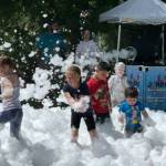 Children frolic in the foam at Montesanos Kids Fest at Fleet Park on Saturday.