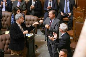 Ryan Berry / Washington State Standard
Senate Minority Leader John Braun, R-Centralia, fist bumps Rep. Ed Orcutt, R-Kalama after being acknowledged during Gov. Bob Fergusons inaugural address Wednesday, Jan. 15, at the Washington State Capitol in Olympia.