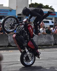 Jerry Knaak / The Daily World
A stunt rider from 1 Wheel Revolution performs for the Ocean Shores Hog Wild Crowd along Chance a la Mer.