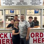 Debbie and Adam Erickson and crew from In & Out Shack BBQ late Saturday.