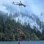 National Forest Service
A helicopter dips into Lake Cushman for water to battle the Bear Gulch Fire.