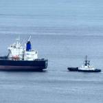 A tug tethers to an Anacortes-bound tanker as it turns into Rosario Strait carrying crude oil from Alaska.