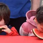 Youngsters take part in a watermelon eating competition at Summerfest 2025.