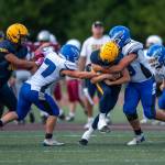 PHOTO BY FOREST WORGUM The Elma Eagles (blue/white) defend against the Forks Spartans during the Montesano Jamboree on Friday at Jack Rottle Field in Montesano.
