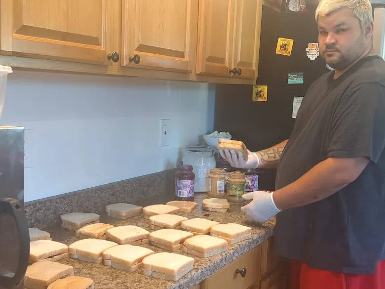 Photo by Barbara Weza
James Petersen makes peanut butter and jelly sandwiches to give to people who need them in the Grays Harbor community.