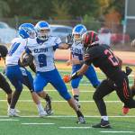 DYLAN WILHELM | THE CHRONICLE Elmas Colt Landstrom (9) carries the football in a win over Centralia on Friday in at Tigers Stadium in Centralia.