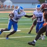 DYLAN WILHELM | THE CHRONICLE Elma quarterback Isaac McGaffey (3) follows the block of Kolby Rademacher (17) during a 41-28 victory over Centralia on Friday in at Tigers Stadium in Centralia.