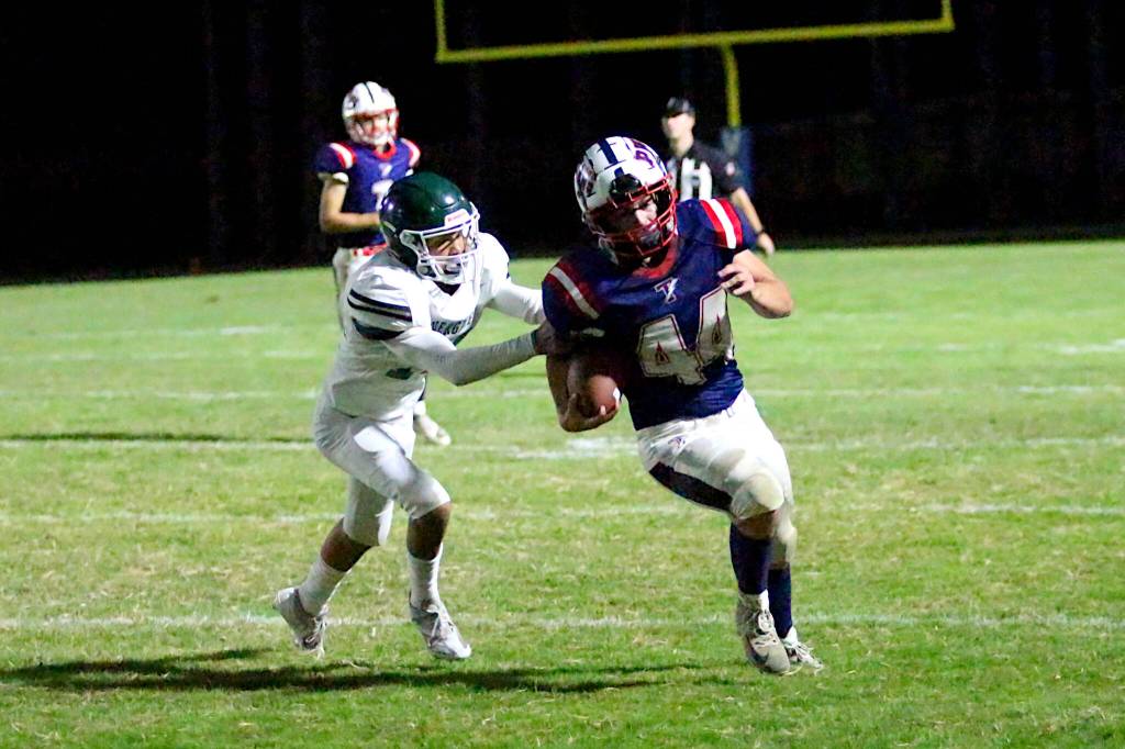 RYAN SPARKS | THE DAILY WORLD Pe Ell-Willapa Valley running back Spud Swogger (44) carries the ball during the Titans 41-8 win on Friday in Menlo.