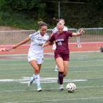 RYAN SPARKS | THE DAILY WORLD Montesanos Olivia Reynvaan (right) dribbles away from Cedar Park Christians Brynna Balkcum during the Bulldogs 3-0 loss on Saturday in Montesano.