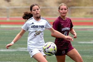 RYAN SPARKS | THE DAILY WORLD Montesanos Kylee Geelan (right) defends Cedar Park Christians Maddie Barnes during the Bulldogs 3-0 loss on Saturday at Jack Rottle Field in Montesano.