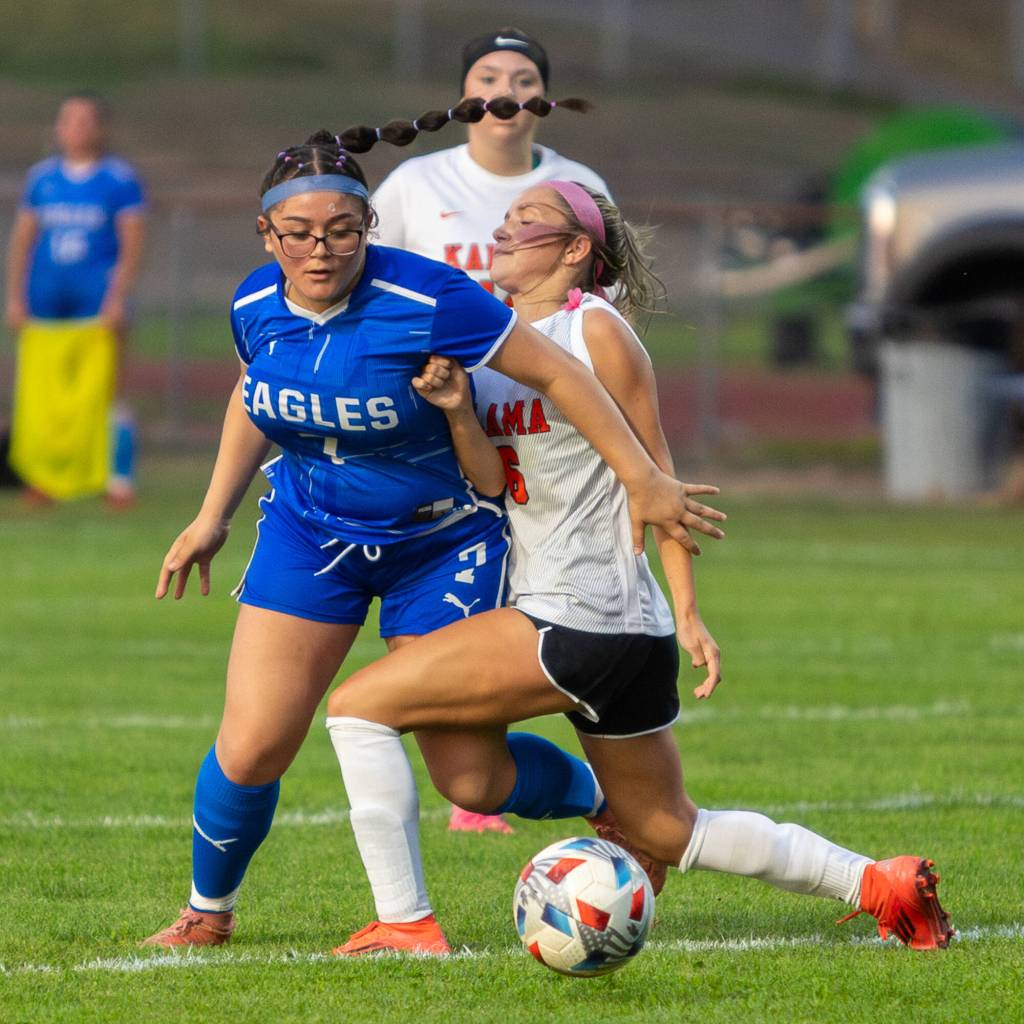 PHOTO BY MIKE ROBERTS Elma forward Anna Servellon (left) competes for possession during a win over Kalama on Tuesday at Elma High School.
