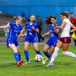 PHOTO BY MIKE ROBERTS Elma defenders (from left) Mikayla Roberts, Myah Goldsmith and Natalie Henry slow down W.F. West forward Lauren Kelley during a 3-0 loss on Thursday in Elma.