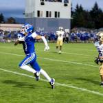 PHOTO BY MIKE ROBERTS Elma receiver Dayton Brookins (1) runs away from Highlines Ethan Phannguyen during the Eagles 31-28 loss on Friday at Davis Field in Elma.