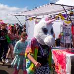 The unicorn parade marches in front of vendors at the annual Love Reigns: Grays Harbor Pride Festival on Saturday.