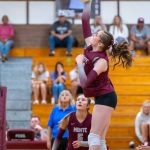 PHOTO BY FOREST WORGUM Montesano middle blocker Violet Prince (foreground) attempts a kill as Makena Blancas looks on during the Bulldogs 3-2 win over Black Hills on Monday in Montesano.